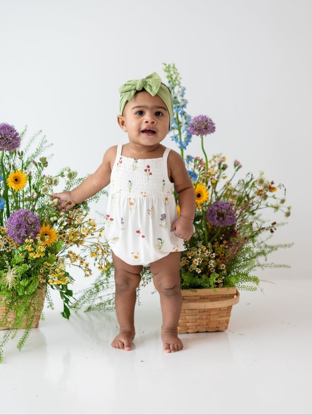 Kyte Baby Smocked Bubble Romper In Wildflower Size 6-12 Months